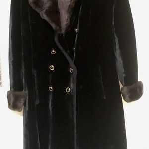 Black knee length faux fur coat.  Satin Lined with knit insulated layer